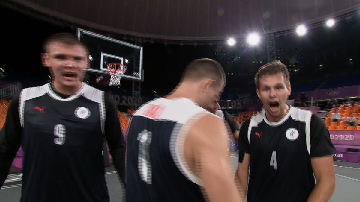 The Russian Olympic Committee basketball 3x3 team celebrates after a win