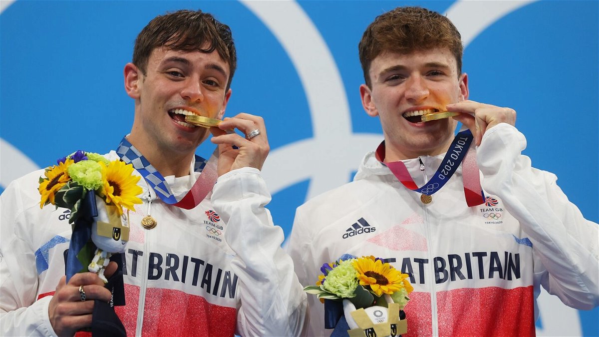 Tom Daley accepts first Olympic gold with partner Matty Lee