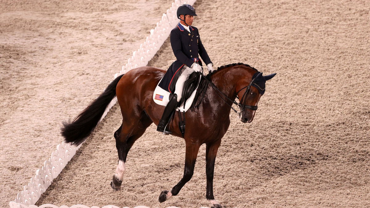 Steffen Peters and horse Suppenkasper ride a dressage test in an arena