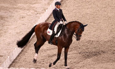 Steffen Peters and horse Suppenkasper ride a dressage test in an arena