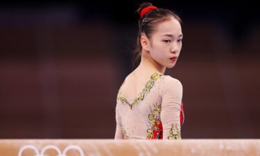 China's Guan Chenchen leads in women's balance beam scoring