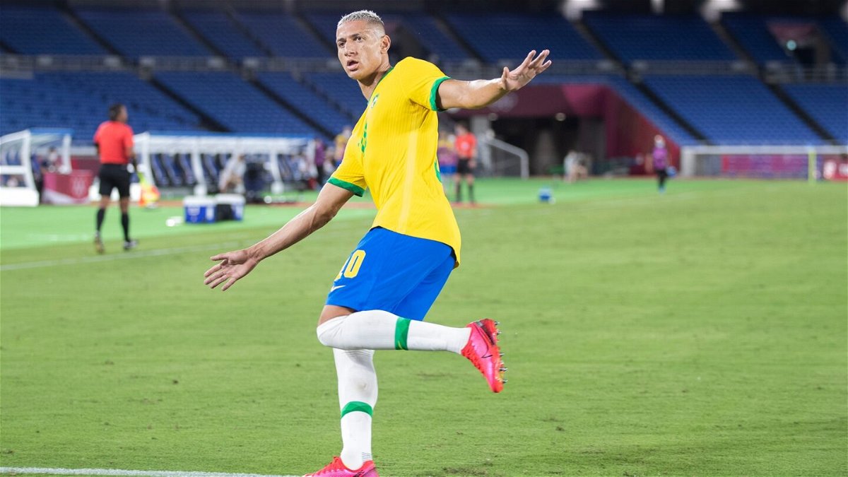 Richarlison of Brazil celebrates after scoring his team's second goal in the Men's First Round Group D match between Brazil and Germany.