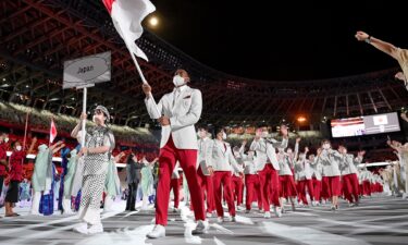 Rui Hachimura leads Japan through Olympic Stadium in the Parade of Nations.