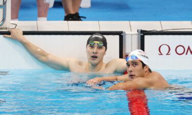 Seto Daiya (left) looks on in disbelief after missing the final of the men's 400m IM. American Jay Litherland (right) successfully advanced.