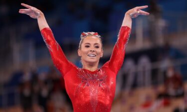 MyKayla Skinner salutes the judges after competing on balance beam during the qualification round of the women's artistic gymnastics competition in Tokyo