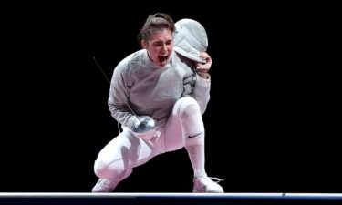 Sofia Pozdniakova celebrates winning a gold medal in the women's individual sabre event