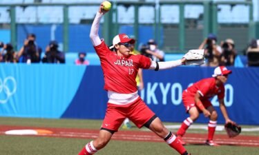 Pitcher Yukiko Ueno of Japan winds up for a pitch in the first inning during the Tokyo 2020 Olympic Games against Australia at Fukushima Azuma Baseball Stadium.