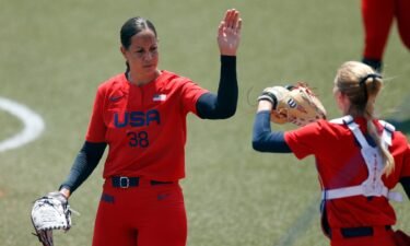 United States pitcher Cat Osterman celebrates with catcher Aubree Munro against Italy in an opening round softball game during the Tokyo Olympic Games at Fukushima Azuma Stadium.