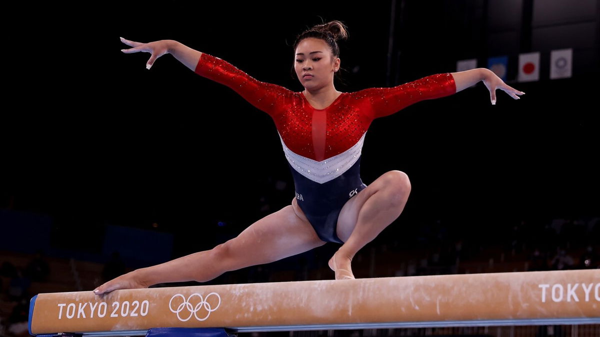 Sunisa Lee competes on the balance beam during the team final of the women's artistic gymnastics competition in Tokyo