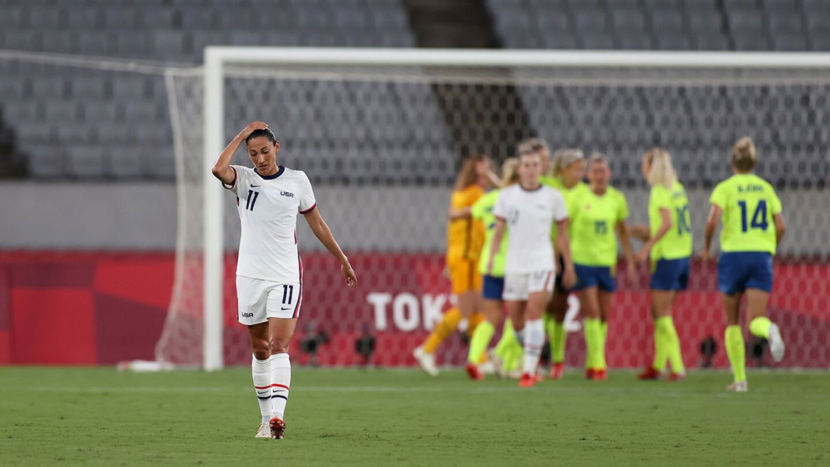 U.S. forward Christen Press reacts to Sweden scoring the last of three goals in a Tokyo Olympics group stage match.