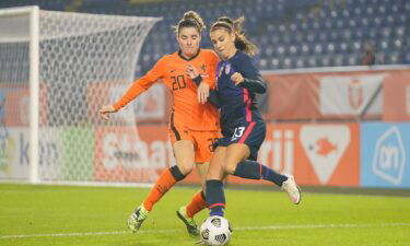 Alex Morgan and Dominique Janssen fight for a ball.