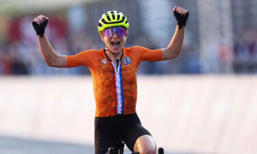 Annemiek van Vleuten of Team Netherlands celebrates crosses the finishing line