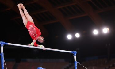 China's Xijing Tang competes on uneven bars during women's qualification