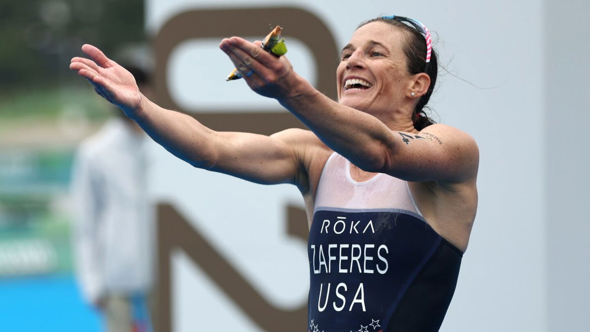 Katie Zaferes of Team United States celebrates winning the bronze medal during the Women's Individual Triathlon on day four of the Tokyo 2020 Olympics