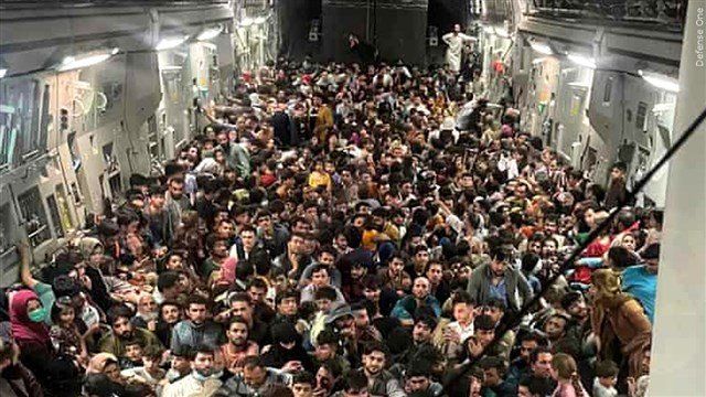 Afghans inside US military cargo plane C-17 Globemaster III, flown from Afghanistan to Qatar, following the fall of the capital Kabul to the Taliban
