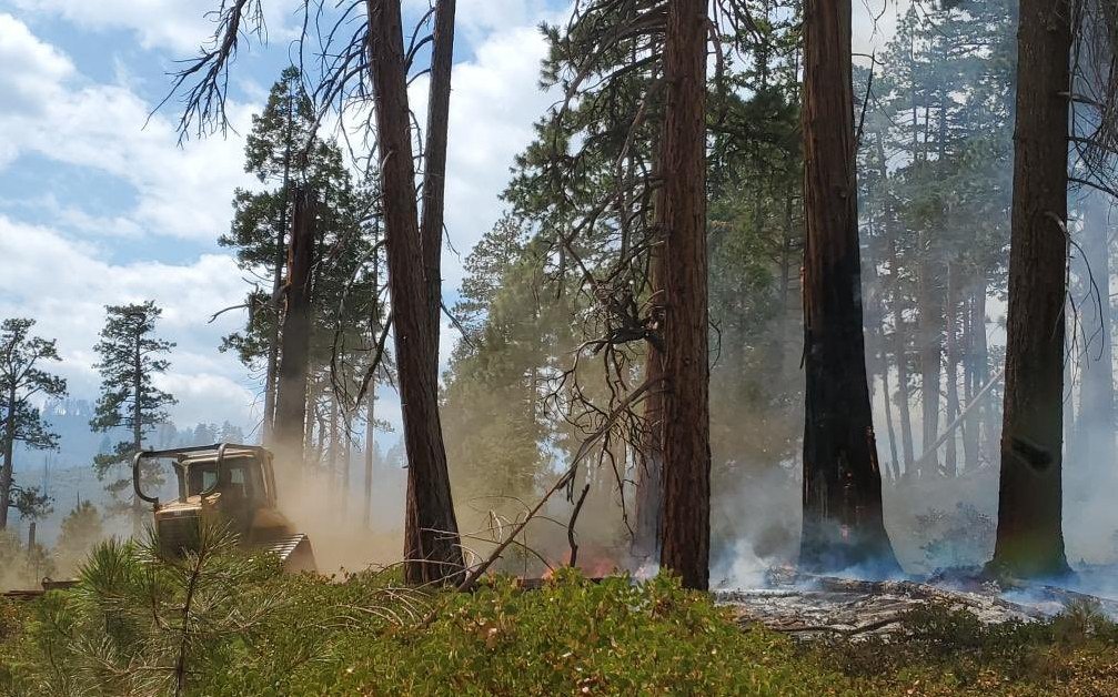 Bulldozer works to secure containment lines on Bean Creek Fire