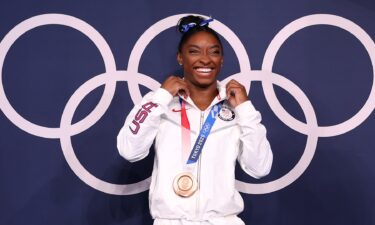 Biles smiles with her bronze medal.