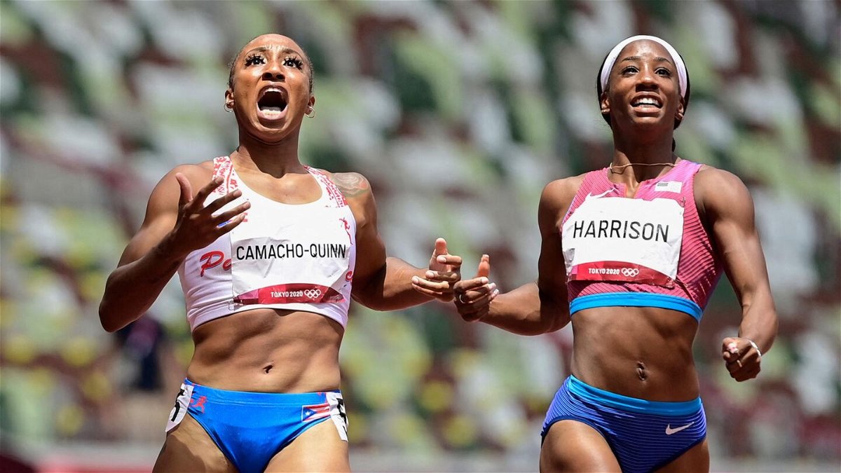Puerto Rico's Jasmine Camacho-Quinn (L) wins ahead of USA's Kendra Harrison in the women's 100m hurdles final during the Tokyo 2020 Olympic Games
