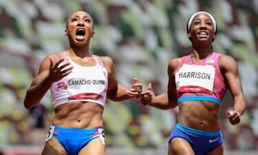 Puerto Rico's Jasmine Camacho-Quinn (L) wins ahead of USA's Kendra Harrison in the women's 100m hurdles final during the Tokyo 2020 Olympic Games