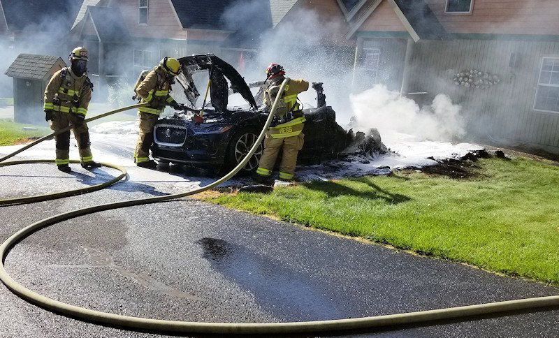 Redmond firefighters took special precautions to dose a fire that destroyed an electric car Monday morning