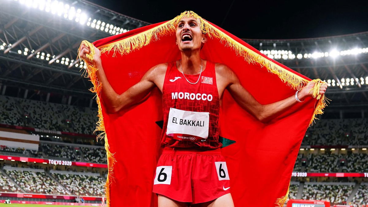 Soufiane Elbakkali of Morocco celebrates winning the gold medal after the Men's 3000m Steeplechase - Final on day ten of the Tokyo 2020 Olympic Games