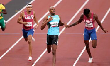 Steven Gardiner of Team Bahamas finishes ahead of Michael Cherry of Team United States and Michael Norman of Team United States to win the gold medal in the Men's 400m Final on day thirteen of the Tokyo 2020 Olympic Games