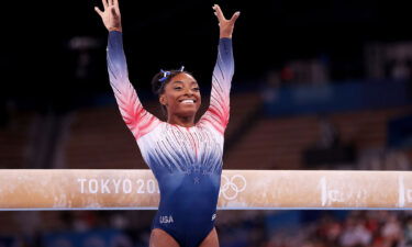 Simone Biles competes on beam