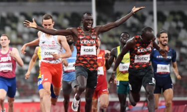 Kenya's Emmanuel Kipkurui Korir (C) reacts after winning next to second placed Kenya's Ferguson Cheruiyot Rotich after the men's 800m final during the Tokyo 2020 Olympic Games