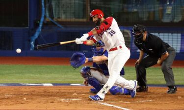 A member of the Dominican Republic baseball makes contact for a clean hit