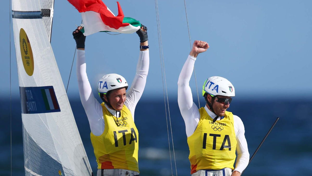 The Italian sailing team celebrates after their gold medal race