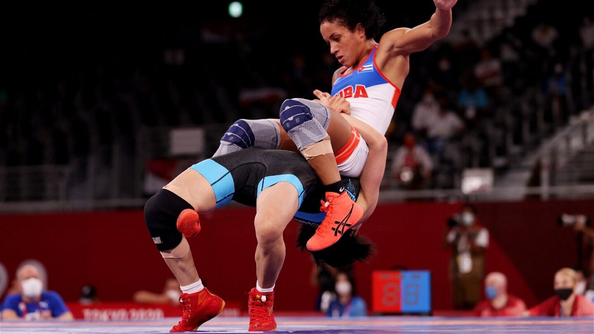 Belly to back suplex in Olympic wrestling ring
