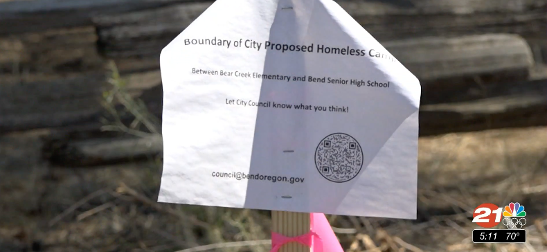 Notice was added to stakes marking property lines for proposed manage homeless camp on NE Ninth Street