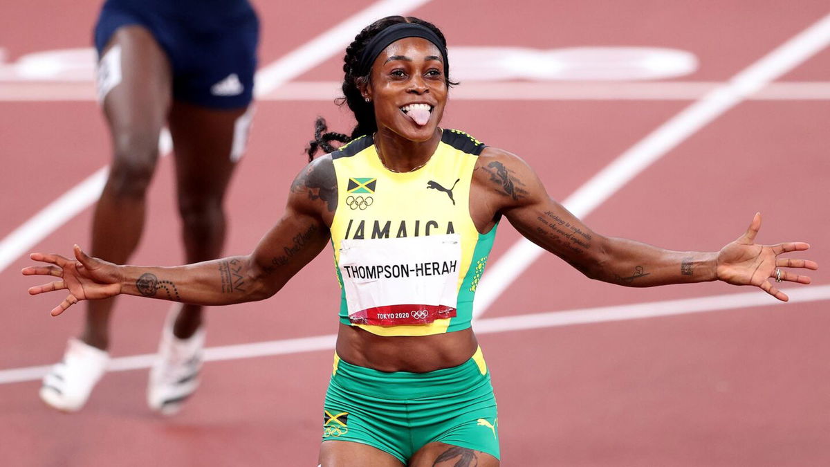 Elaine Thompson-Herah of Team Jamaica celebrates after winning the gold medal in the Women's 200m Final on day eleven of the Tokyo 2020 Olympic Games