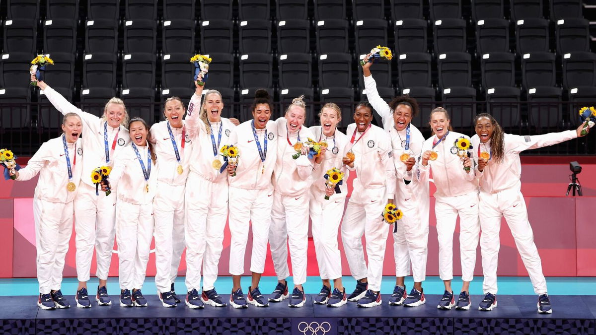 Players of Team United States react after receiving their Gold Medals during the Victory Ceremony following the Women's Gold Medal Volleyball match between Brazil and United States on day sixteen of the Tokyo 2020 Olympic Games