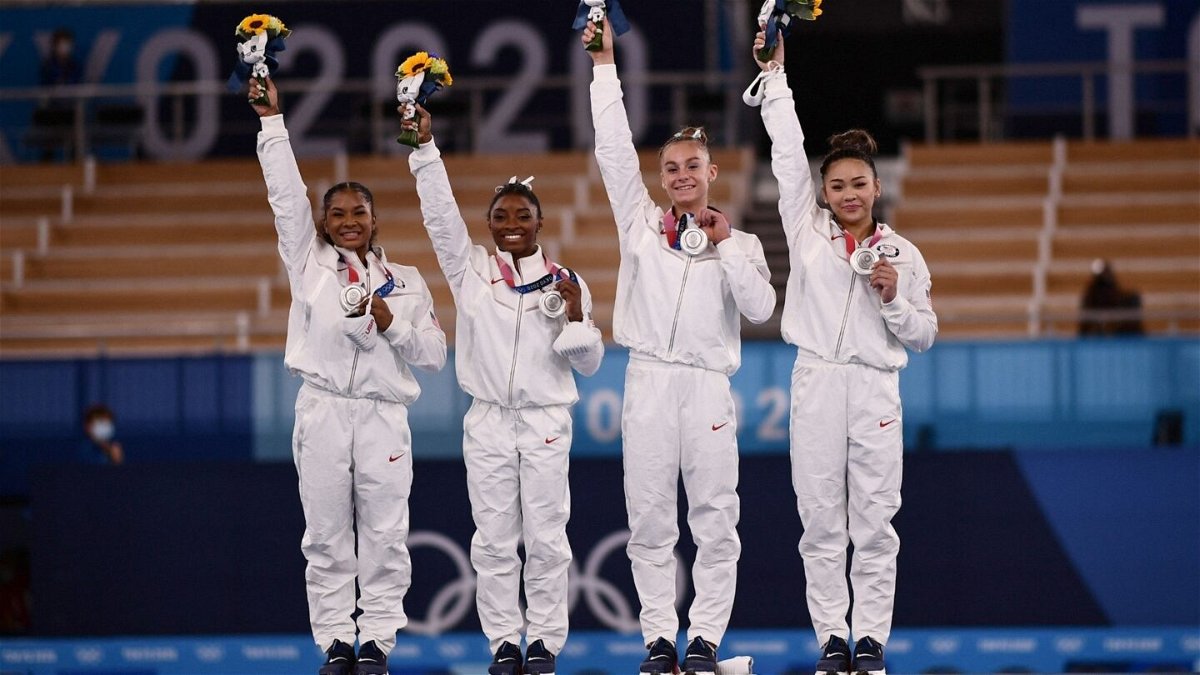 Team USA's gymnastics team celebrate silver in the all-around competition