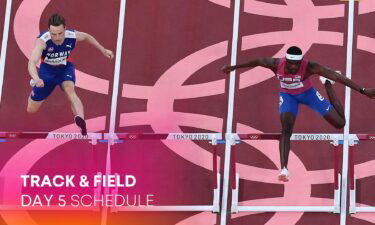 Norway's Karsten Warholm (L) and USA's Rai Benjamin compete in the men's 400m hurdles semi-finals during the Tokyo 2020 Olympic Games