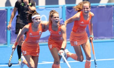 An ecstatic trio of Netherlands player celebrate one of five goals against GB