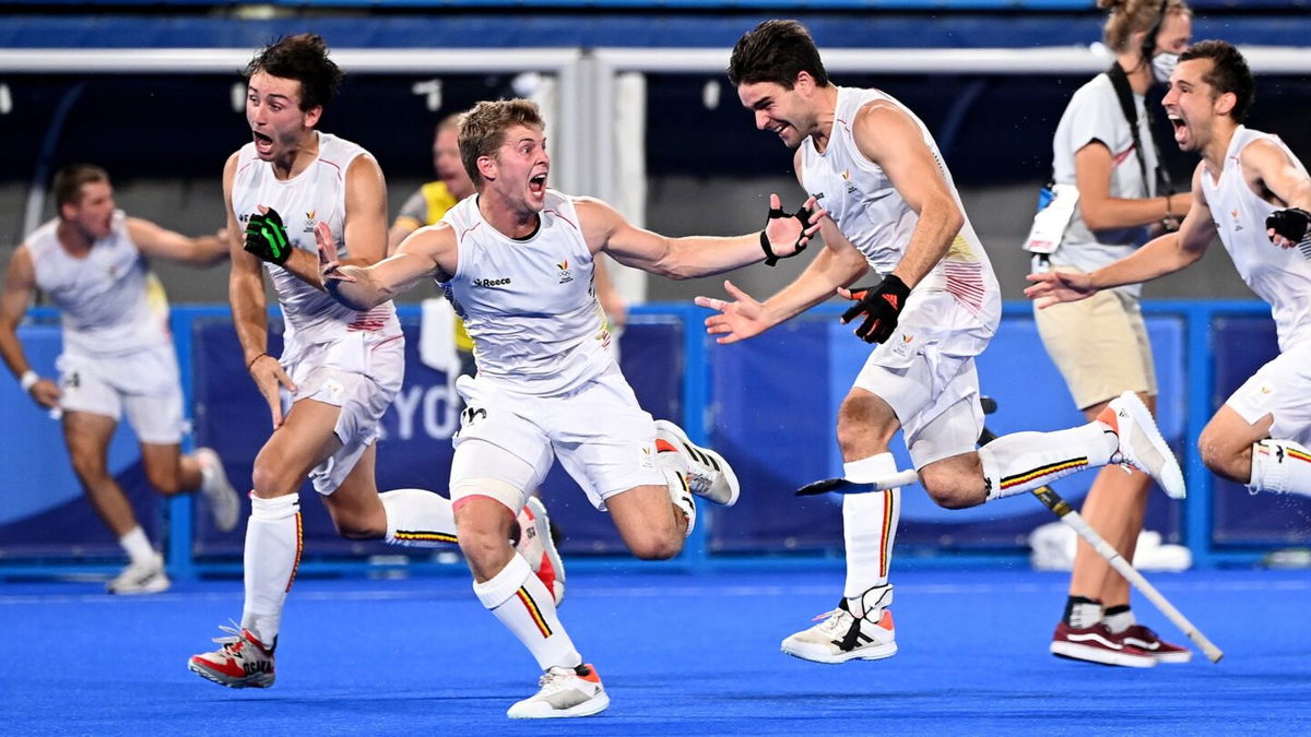 Overjoyed Belgian players celebrate victory after winning the gold medal final match over Australia