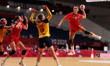 Nora Moerk goes airborne to fire a shot on Sweden's goal in the bronze medal match