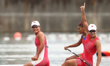 Xu Shixiao and Sun Mengya celebrate after winning the Women's Canoe Double 500m Final A