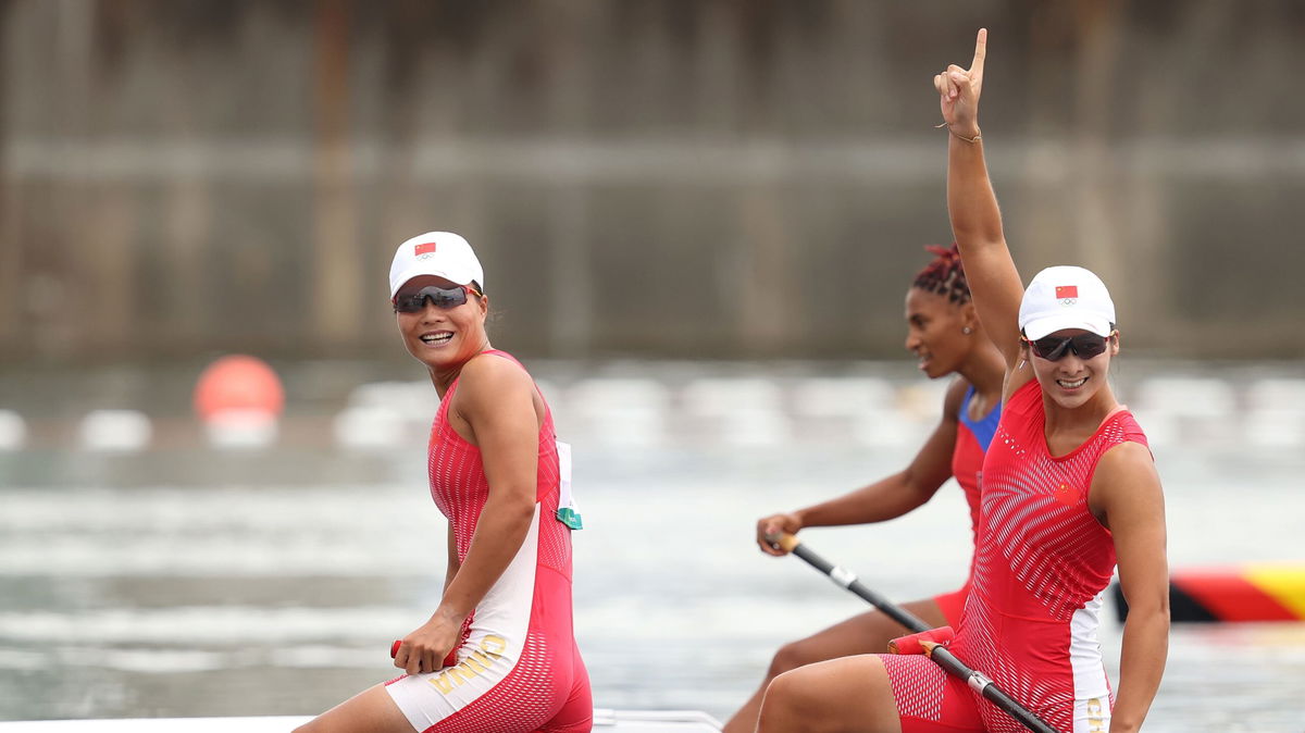 Xu Shixiao and Sun Mengya celebrate after winning the Women's Canoe Double 500m Final A