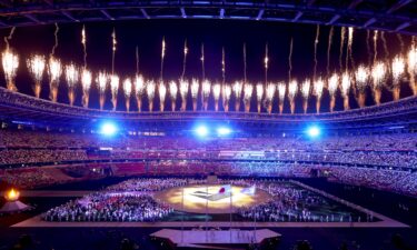 Fireworks erupt above the stadium during the Closing Ceremony of the Tokyo 2020 Olympic Games