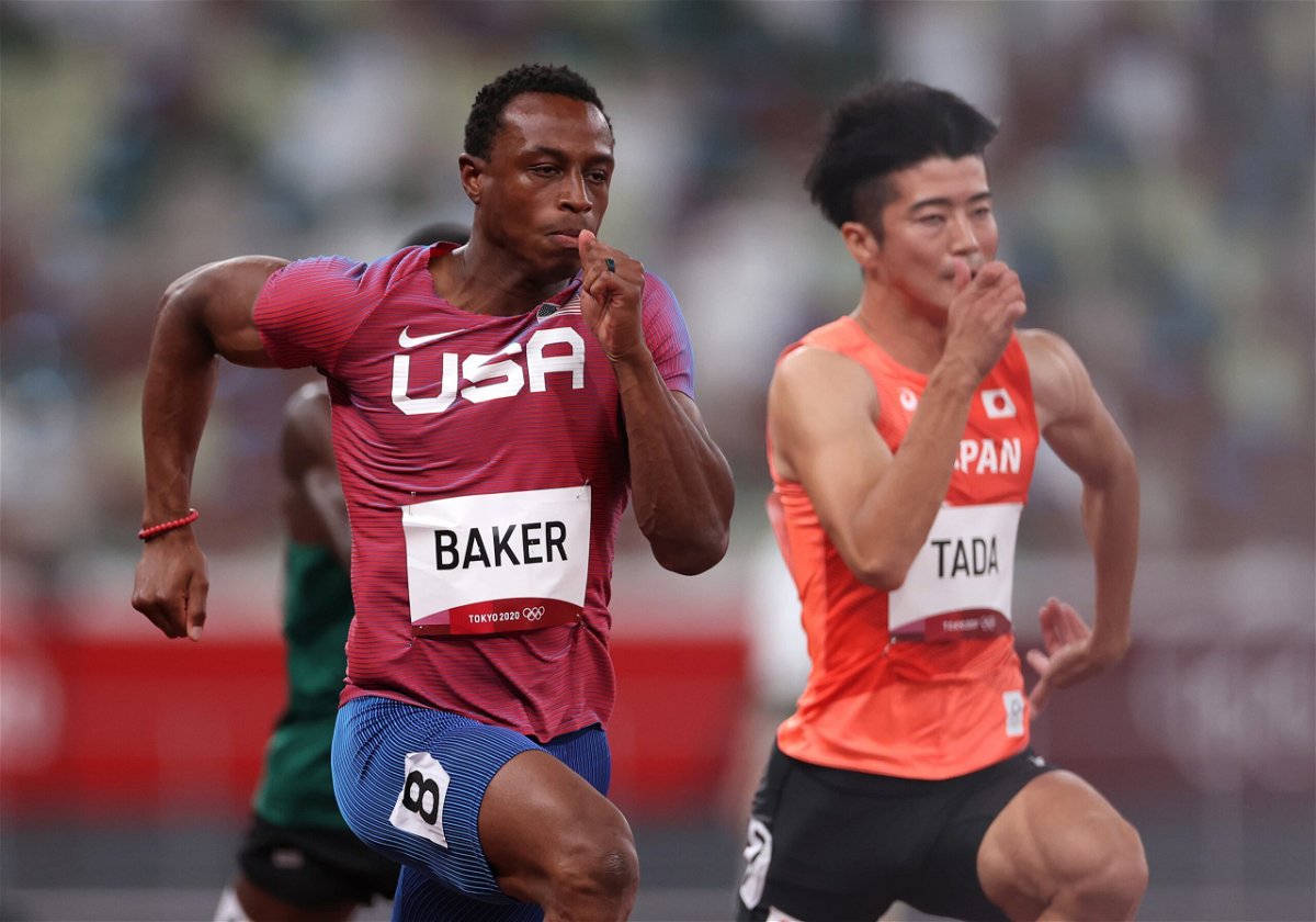Ronnie Baker and Tada Shuhei compete in the Men's 100m Round 1
