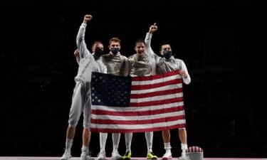 USA's foil team celebrates after winning against Japan's in the men's team foil bronze medal bout during the Tokyo 2020 Olympic Games