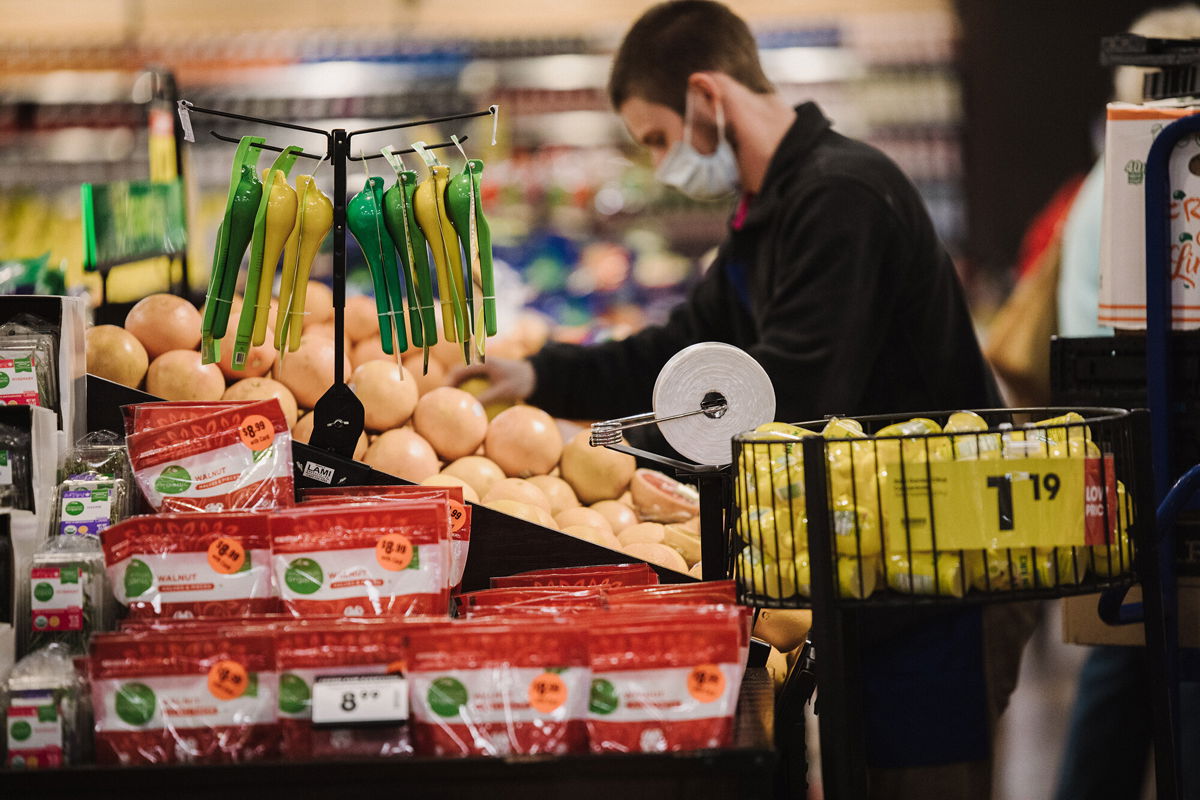 <i>Scotty Perry/Bloomberg/Getty Images</i><br/>Shares of Kroger are up nearly 50% this year and trading at an all-time high. A Kroger worker here restocks produce in Versailles