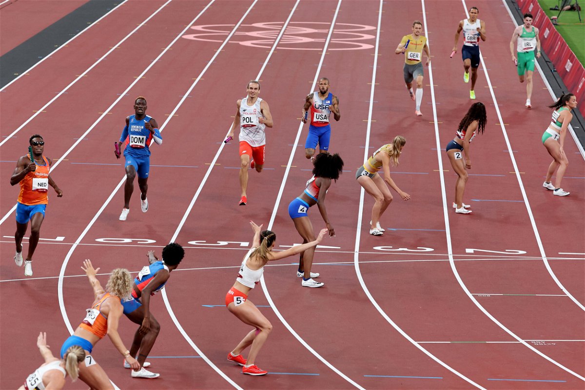 <i>Giuseppe Cacace/AFP/Getty Images</i><br/>Athletes compete in the mixed 4x400m relay final during the Tokyo 2020 Olympic Games at the Olympic Stadium in Tokyo on July 31.