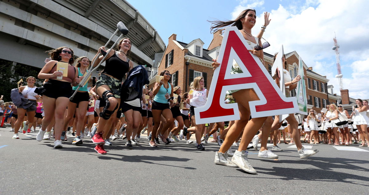 <i>Gary Cosby Jr./Tuscaloosa News/USA Today Network</i><br/>New sorority sisters run to their houses at the University of Alabama after receiving their bids on Aug. 15. The highs and heartbreaks of 
