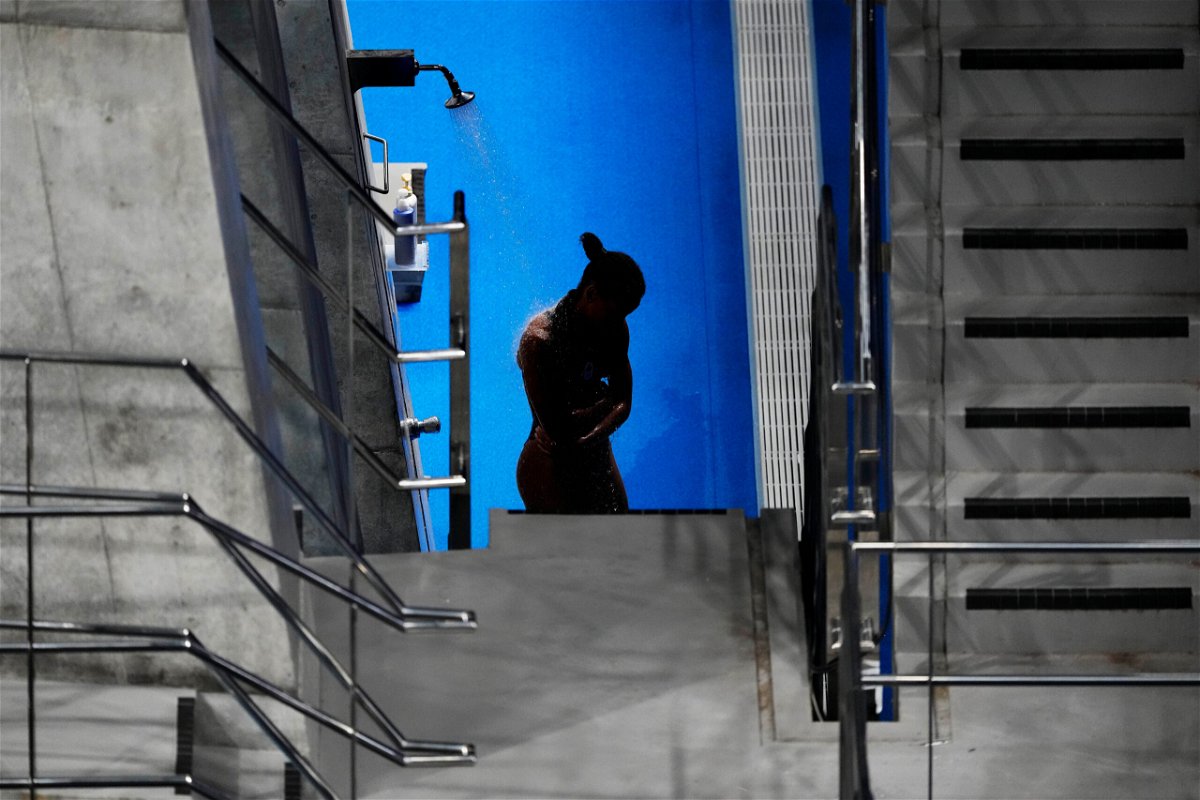<i>David Goldman/AP</i><br/>Jennifer Abel of Canada rinses off in between rounds of the women's diving 3-meter springboard preliminary event at the Tokyo Olympics on July 30