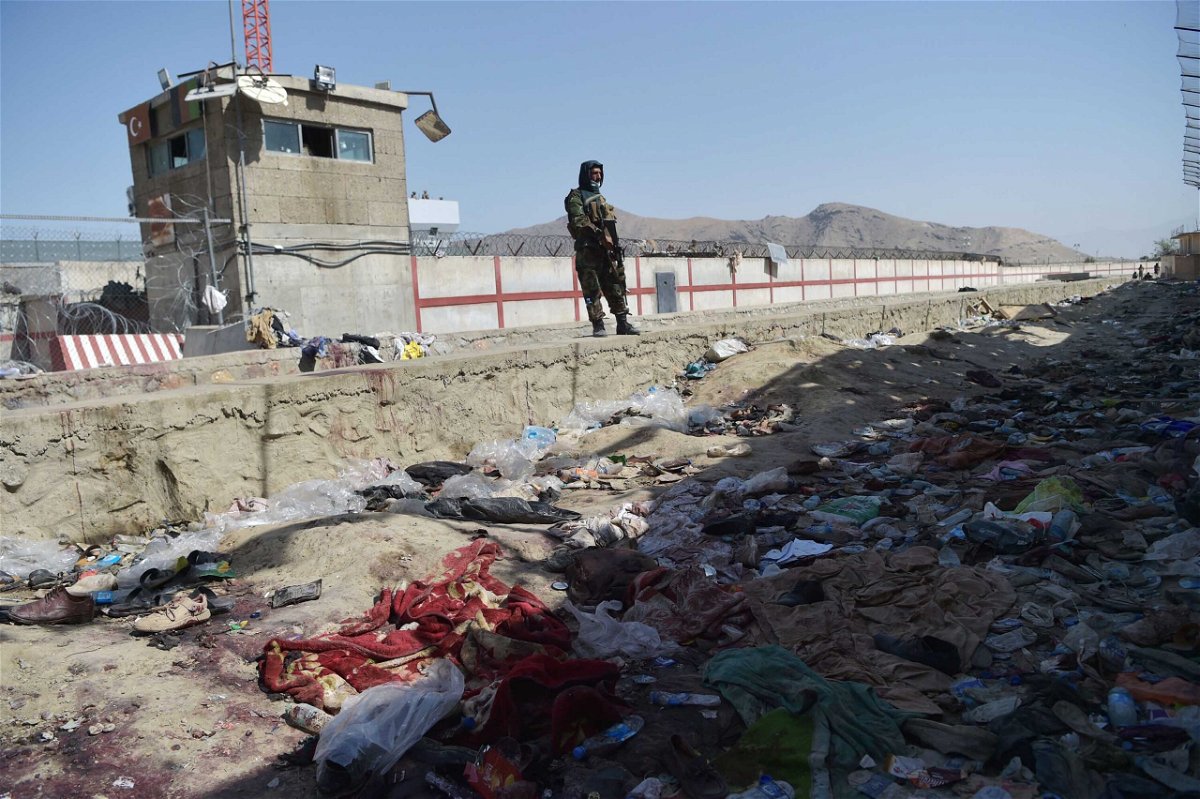 <i>Wakil Kohsar/AFP/Getty Images</i><br/>A Taliban fighter stands guard at the site of the August 26 suicide attack
