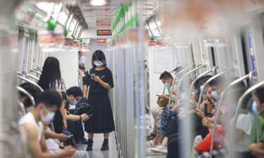 People wear face masks on the subway amid the Delta variant outbreak on July 27 in Nanjing